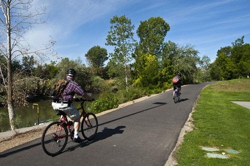 Chris Detrick  |  The Salt Lake Tribune
Cyclists bike Wednesday on the Jordan River Parkway Trail near Oxbow Park.  A complete map of the trail system has been released and is now available to the public.