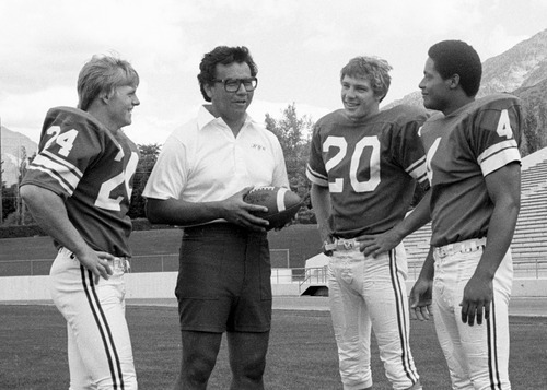 Coach Norm Chow with Bill Ring (24), Scott Phillips (20) and  Casey Wingard (4) are pictured in this 1978 photo. Mark Philbrick/BYU
