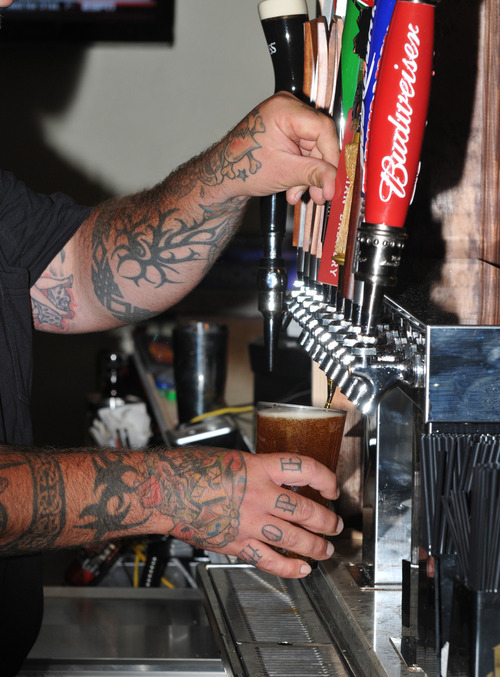 Bobby Robertson  |  For the Salt Lake Tribune
Manager Greg Buchete pours a Bohemian draft beer behind the bar at The Veranda, located at 4760 S. 900 East in Murray.