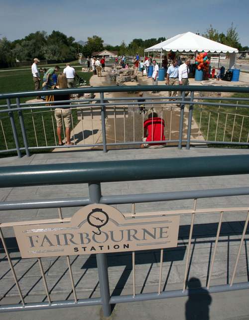 Steve Griffin | The Salt Lake Tribune

West Valley City has opened the Fairbourne Station Promenade, a four-acre park, with a dedication ceremony and community picnic. The park has interactive features, including a scale that will depict the weight of a group of people standing on it in terms of chickens, cows and bales of hay.