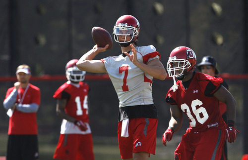 Scott Sommerdorf  |  The Salt Lake Tribune             
Utah QB Travis Wilson, 7, drops back to throw with freshman RB Jerrell Oliver, 36, protecting, as opening day of Utah football training camp is under way, Thursday, August 2, 2012.