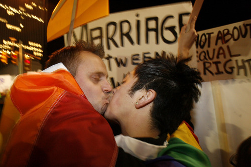 Chris Detrick | The Salt Lake Tribune
Dan Bushman, left, kisses Sean Woodward during a protest outside of Temple Square over Prop. 8 in 2008.