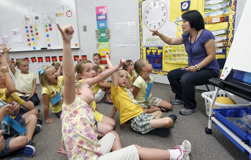 Al Hartmann  |  The Salt Lake Tribune  
The Jordan School District has seen interest in its dual immersion language programs skyrocket. Pei Chi Chang teaches first- graders  a counting excercise in the Chinese language program at Foothills Elementary in Riverton.