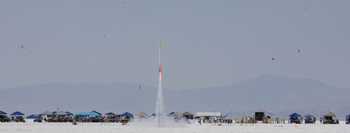 Paul Fraughton | Salt Lake Tribune
TThe rocket of Jim and Tobin Yehle blasts off at the Utah Rocket Club's Hellfire 2012, an annual rocket launch  held on the Bonneville Salt Flats near Wendover.
 Friday, August 3, 2012