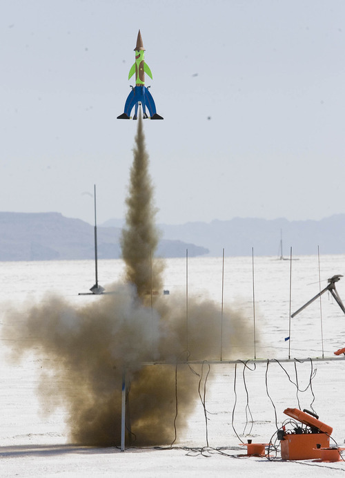 Paul Fraughton | Salt Lake Tribune
One of the more whimsical rockets leaves the launching pad at the Utah Rocket Club's Hellfire 2012, an annual rocket launch  held on the Bonneville Salt Flats near Wendover.
 Friday, August 3, 2012