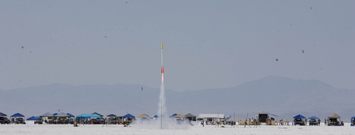 Paul Fraughton | Salt Lake Tribune
The rocket of Jim and Tobin Yehle blasts off at the Utah Rocket Club's Hellfire 2012, an annual rocket launch  held on the Bonneville Salt Flats near Wendover.
 Friday, August 3, 2012