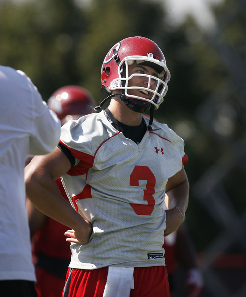 Scott Sommerdorf  |  The Salt Lake Tribune             
Utah QB Jordan Wynn turns to look at Offensive Coordinator Brian Johnson after hitting a deep receiver during the opening day of Utah football training camp, Thursday, August 2, 2012.