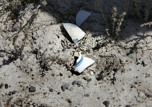 Scott Sommerdorf  |  The Salt Lake Tribune             
Broken shards of china litter the ground within 
