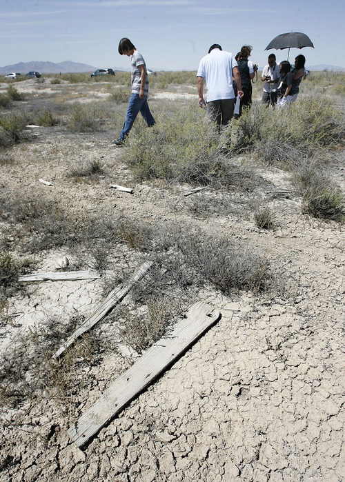 Scott Sommerdorf  |  The Salt Lake Tribune             
Small relics and hints to the area's past, like weathered board with rusty nails in them litter the ground at the Topaz Relocation Camp, where Japanese-Americans were sent during World War II. Families of former internees search the area, Saturday, August 4, 2012