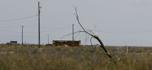 Scott Sommerdorf  |  The Salt Lake Tribune             
A school bus takes former internees and their families on a tour of the desolate Topaz Internment Camp northwest of Delta, Saturday Aug. 4, 2012.
