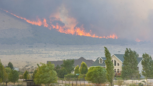 Paul Fraughton | Salt Lake Tribune
The  lightning caused  Pinion Fire burns behind homes in the North Ranch Subdivision in Eagle Mountain.
 Monday, August 6, 2012