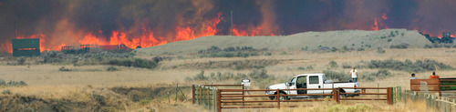 Steve Griffin | The Salt Lake Tribune


Anxious residents keep an eye on a wildfire that burns out of control near Camp Williams and Eagle Mountain, Utah Monday August 6, 2012.