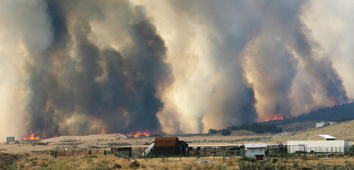 Steve Griffin | The Salt Lake Tribune


A wildfire burns out of control near Camp Williams and Eagle Mountain, Utah Monday August 6, 2012.