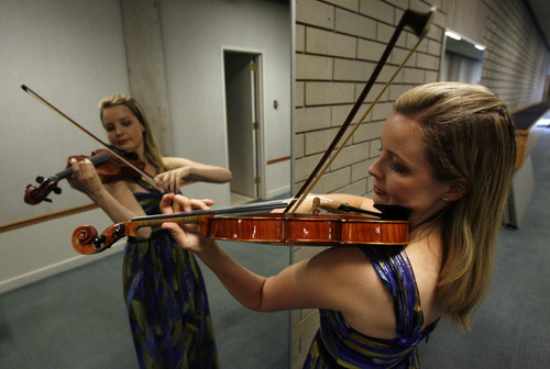 Francisco Kjolseth  |  The Salt Lake Tribune
Violinist Kathryn Eberle, who is starting her second year as associate concertmaster of the Utah Symphony, often times uses a mirror to check her form as she practices. o
