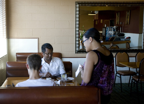 Kim Raff | The Salt Lake Tribune
Waitress Lourie Samol takes (back) Chanda Choun and Chris Camp's order at Thai Aroy-D review in Salt Lake City, Utah on August 3, 2012.