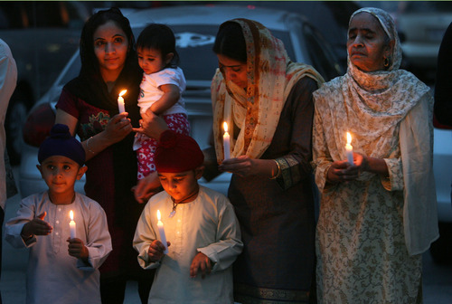 Steve Griffin | The Salt Lake Tribune


 Members of the Sikh Temple of Utah, stand outside the temple during a candlelight vigil for the victims of the shooting at the Wisconsin Sikh Temple. The service was at the temple in  Taylorsville, Utah Wednesday August 8, 2012.