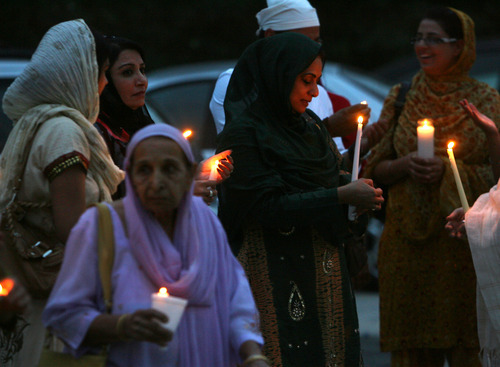 Steve Griffin | The Salt Lake Tribune


 Members of the Sikh Temple of Utah, stand outside the temple during a candlelight vigil for the victims of the shooting at the Wisconsin Sikh Temple. The service was at the temple in Taylorsville, Utah Wednesday August 8, 2012.