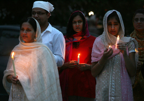 Steve Griffin | The Salt Lake Tribune


 Members of the Sikh Temple of Utah, stand outside the temple during a candlelight vigil for the victims of the shooting at the Wisconsin Sikh Temple. The service was at the temple in Taylorsville, Utah Wednesday August 8, 2012.