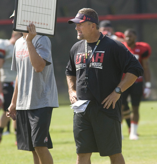 Paul Fraughton | Salt Lake Tribune
Coach Kyle Whittingham watches his team scrimege at Tuesday's practice.
 Tuesday, August 7, 2012