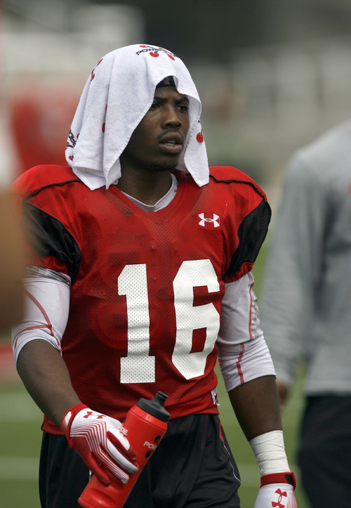 Francisco Kjolseth  |  The Salt Lake Tribune
Geoff Norwood tries to keep cool in the summer heat as the University of Utah football team gets ready for the season with a scrimmage game at Rice-Eccles stadium on Friday, August 10, 2012.