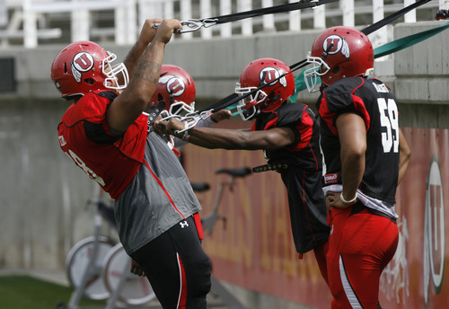 Francisco Kjolseth  |  The Salt Lake Tribune
Physical therapy doesn't stop as the University of Utah football team gets ready for the season during team practice at Rice-Eccles stadium on Friday, August 10, 2012.