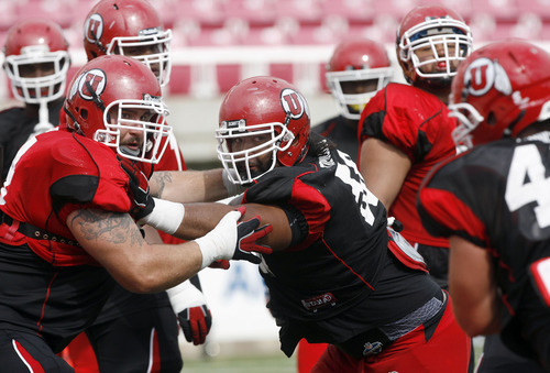 Francisco Kjolseth  |  The Salt Lake Tribune
Sam Brenner, left, and LT Tuipulotu keep an eye on which way the ball is moving as the University of Utah football team gets ready for the season during team practice at Rice-Eccles stadium on Friday, August 10, 2012.