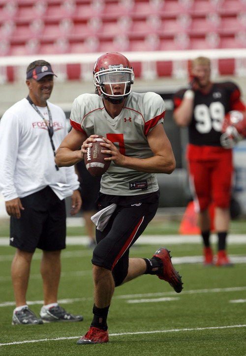 Francisco Kjolseth  |  The Salt Lake Tribune
Coach Kyle Whittingham keeps a watchful eye on a play as quarterback Travis Wilson looks for an opening during a scrimmage game at Rice-Eccles stadium on Friday, August 10, 2012.