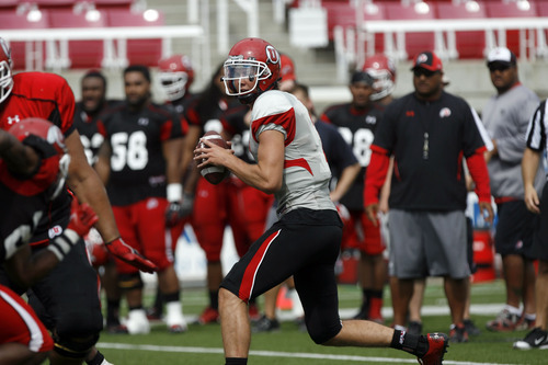 Francisco Kjolseth  |  The Salt Lake Tribune
Quarterback Travis Wilson looks for an open man before deciding to run the ball down field as the University of Utah football team gets ready for the season with a scrimmage game at Rice-Eccles stadium on Friday, August 10, 2012.