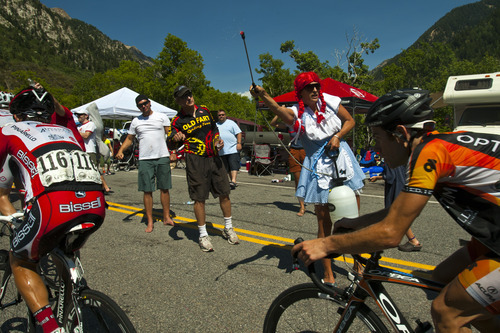 Chris Detrick  |  The Salt Lake Tribune
Fans cheer on bikers as they race up Little Cottonwood Canyon during Stage 5 of the Tour of Utah Saturday August 11, 2012. The 101.1 mile stage raced from Newpark Resort at Kimball Junction to Snowbird Resort.