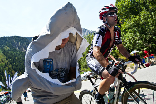 Chris Detrick  |  The Salt Lake Tribune
Shark Nate Friedman, of Salt Lake City, cheers on a biker as he races up Little Cottonwood Canyon during the Ultimate Challenge presented by Larry H. Miller Tour of Utah Saturday August 11, 2012. The traditional 100-mile route features 9,456 feet of climbing and a summit finish at Snowbird Ski and Summer Resort