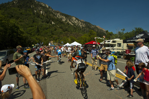 Chris Detrick  |  The Salt Lake Tribune
Fans cheer on bikers as they race up Little Cottonwood Canyon during Stage 5 of the Tour of Utah Saturday August 11, 2012. The 101.1 mile stage raced from Newpark Resort at Kimball Junction to Snowbird Resort.