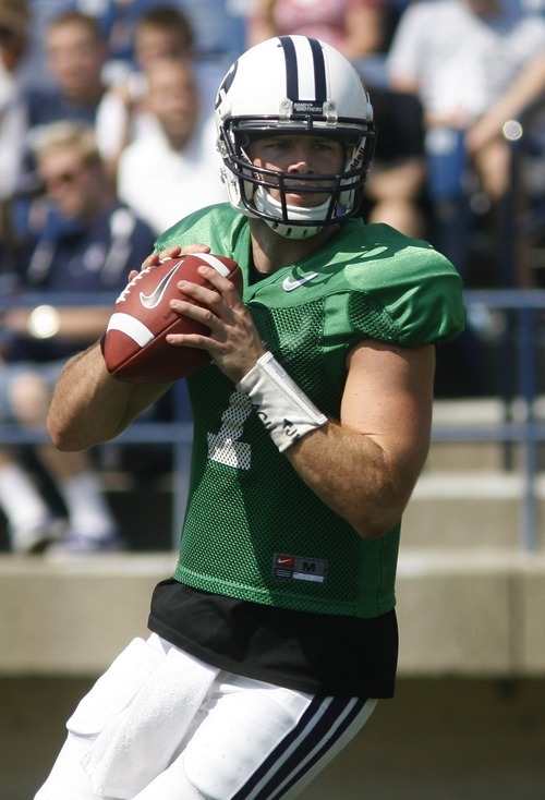 Rick Egan  | The Salt Lake Tribune 

Quarterback James Lark (7) looks for an open man down field, during the scrimmage at LaVell Edwards StadiumThursday, August 9, 2012.