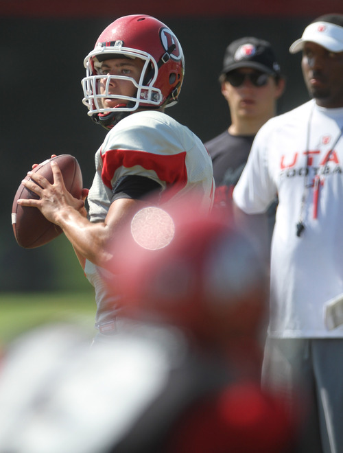 Lennie Mahler  |  The Salt Lake Tribune
Utah quarterback Jordan Wynn looks for a receiver in a practice scrimmage Saturday, Aug. 11, 2012.