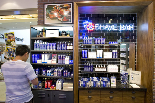 Paul Fraughton | Salt Lake Tribune
A customer looks over the men's section  at Kiehl's, a NewYork City based skin care retailer that held the grand opening of its first Utah store at Fashion Place mall.
 Tuesday, August 14, 2012