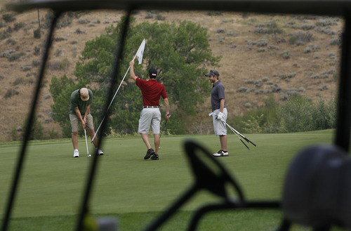 Scott Sommerdorf  |  The Salt Lake Tribune             
A threesome plays golf at Mountain Dell Golf Course, Monday, August 13, 2012.