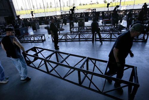 Scott Sommerdorf  |  The Salt Lake Tribune             
The stage crew prepares scaffolding in June for the lighting at USANA Amphitheatre for a concert by Scorpions and Queensryche.