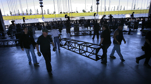 Scott Sommerdorf  |  The Salt Lake Tribune             
The stage crew prepares scaffolding in June for the lighting at USANA Amphitheatre for a concert by Scorpions and Queensryche.