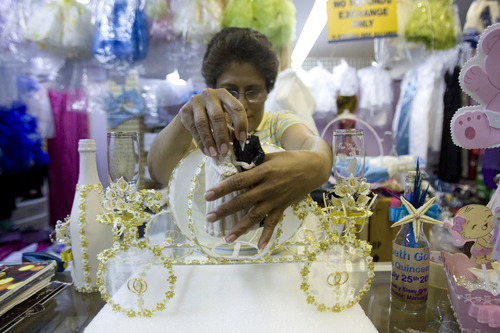 Kim Raff | The Salt Lake Tribune
Carmen Arce finishes a wedding centerpiece in her shop Illusion Crafts at the Azteca Indoor Bazaar and Swap Meet in West Valley City.