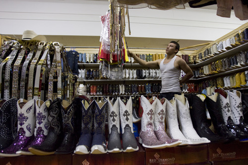 Kim Raff | The Salt Lake Tribune
Oscar Guevara looks around the Vasmin clothing store in the Azteca Indoor Bazaar and Swap Meet in West Valley City on July 21, 2012.