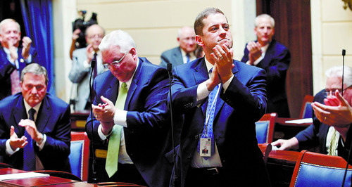 Al Hartmann  |  The Salt Lake Tribune  
Some members of the Utah Senate applaud Su J. Chon after their confirmation vote. 