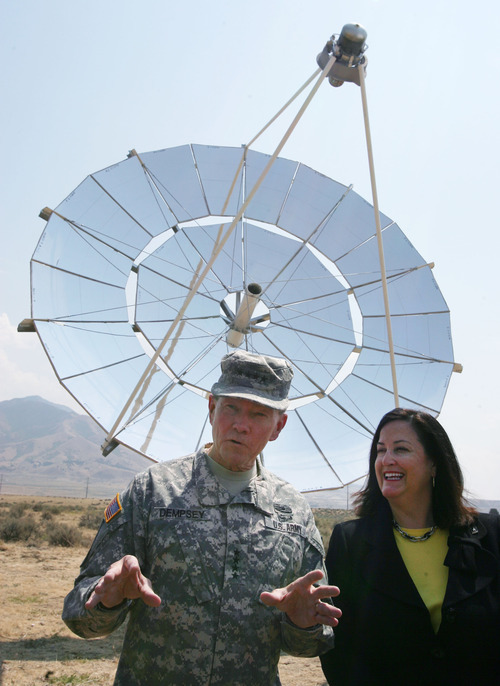 Steve Griffin | The Salt Lake Tribune


 General Martin E. Dempsey, chairman of the Joint Chiefs of Staff, left, and Katherine Hammack, Assistant Secretary of the Army for Installations, Energy and Environment,  talk with the media following groundbreaking ceremony at Tooele Army Depot, for an array of solar turbines pictured in back.  Infinia Corp., an Ogden company, is making the dish-shaped solar collectors called PowerDishes. The ceremony was at the Tooele Army Depot in Tooele, Utah Friday August 17, 2012.