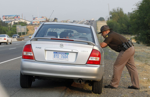 Al Hartmann  |  The Salt Lake Tribune  
Utah Highway Trooper Emery Calkins pulls over a woman driving in the express lane without a passenger -- a violation of highway laws. After studies show one of six drivers in HOV lanes are breaking the rules, state officials launched an advertising campaign and staged a three-day enforcement blitz.