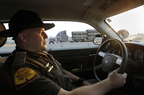 Al Hartmann  |  The Salt Lake Tribune  
Trooper Emery Calkins says drivers always have an excuse for why they're driving in the express lane without a passenger or why they cross the double-white lines. He's heard them all -- including the explanation that the violator did it to avoid an accident.