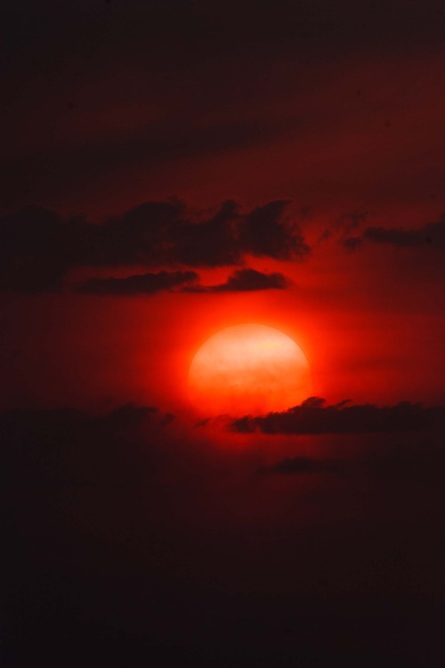 Trent Nelson  |  The Salt Lake Tribune
The setting sun burns through the haze over Salt Lake City on Thursday, Aug. 16, 2012
