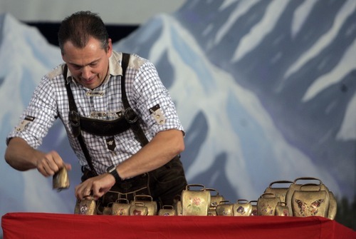 Kim Raff | The Salt Lake Tribune
Rick Schwemmer, Burgermeister or Mayor of Oktoberfest, plays a song on the cowbells during Snowbird's 40th annual Oktoberfest Celebration at Snowbird Ski Resort  on August 18, 2012.