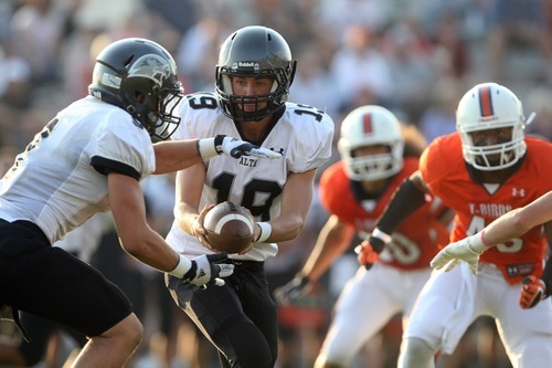 Chris Detrick  |  The Salt Lake Tribune
Alta's Chipper Lucero (19) hands off to Alta's Max Broman (9) during the game at Timpview High School Friday August 17, 2012.