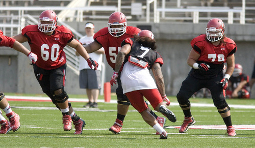 Paul Fraughton | The Salt Lake Tribune
Offensive linemen Siaosi Alono (60), Hiva Lutui (55) and Percy Tamoelau (79) practice at the Ute scrimmage on Tuesday.