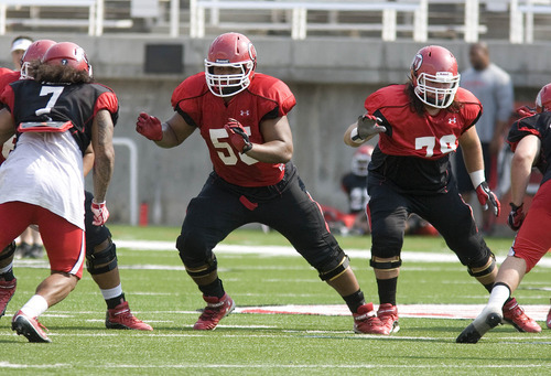 Paul Fraughton | The Salt Lake Tribune
Offensive linemen Hiva Lutui (55) and Percy Tamoelau (79) practice at the Ute scrimmage on Tuesday.