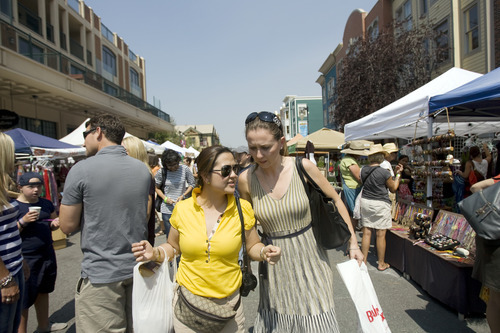 Kim Raff  |  The Salt Lake Tribune
Bernadette Herrera-Dy, left, a representative in the House of Representatives in the Philippines, and Arlinda Dudaj, owner of a publishing house in Albania, walk through the Park Silly Sunday Market in Park City. They are part of the U.S. Department of State's International Visitors Leadership Program where 21 women entrepreneurs from around the world visit cities around the country, including Park City,.