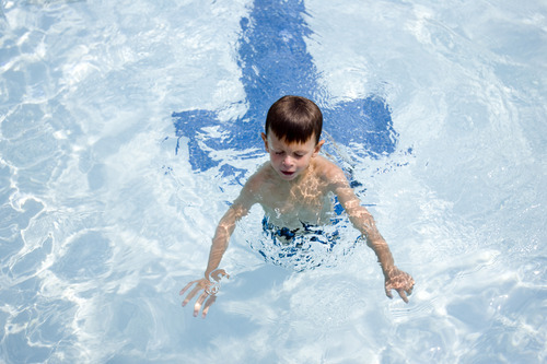 Kim Raff |  The Salt Lake Tribune
Asher Moody swims in the Suncrest Community Pool in Draper, Utah on August 15, 2012. Asher's parents decided it would be best for him to start kindergarten at Summit Academy this month -- after he turned 6 on Aug. 1 -- rather than a year ago, when he'd barely turned 5 by the first day of school.
